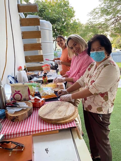 Volunteers preparing food together